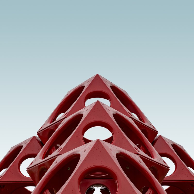 low-angle-red-geometrical-structure-blue-sky